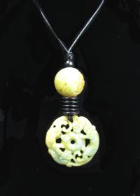 Carved Jade Necklace by DIANA KAHLENBERG